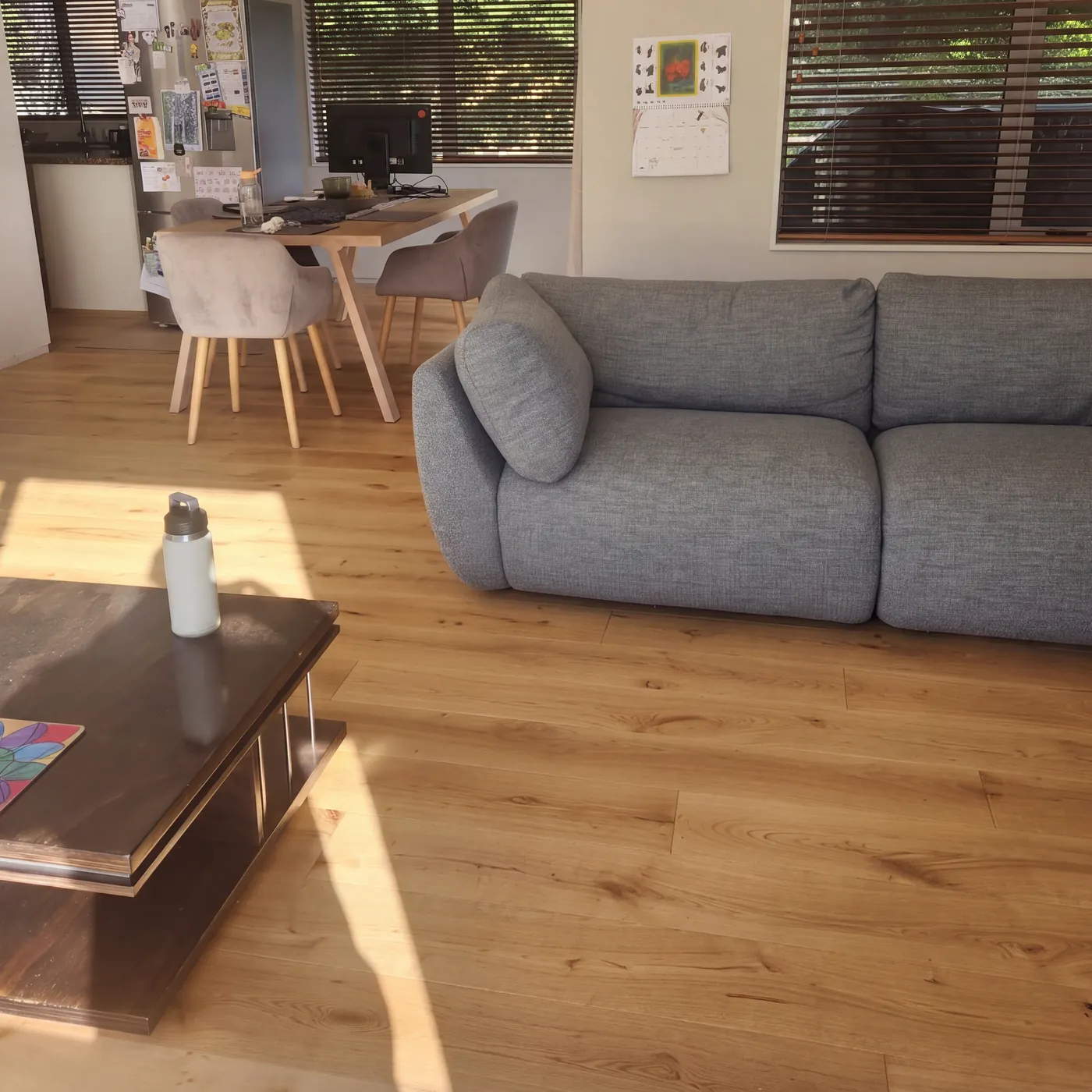 Sunlit oak plank floor in a living room