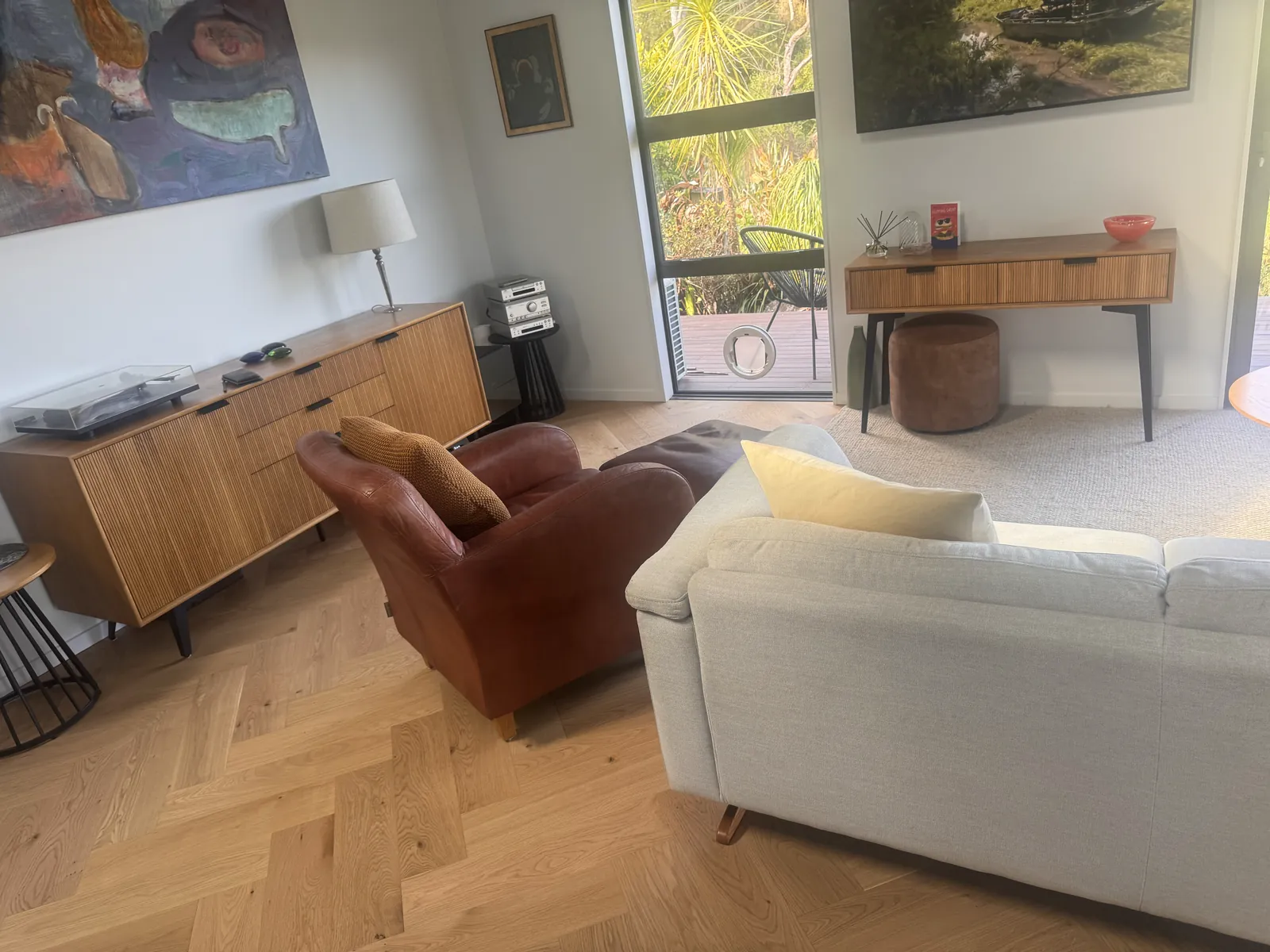 Natural Clear herringbone engineered timber in the furnished lounge at Whangaparaoa Road, Red Beach