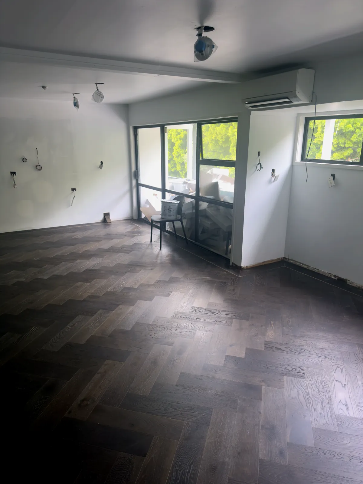 Slate Grey herringbone engineered timber laid across the Manukau Hotel breakfast room