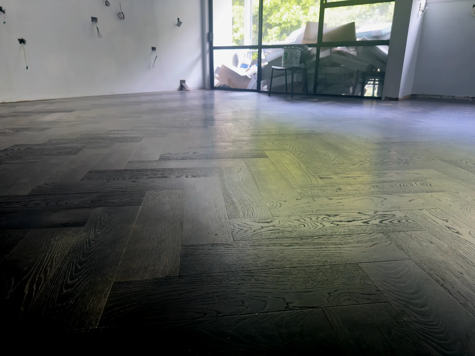 Slate Grey herringbone engineered timber at board level in the Manukau Hotel breakfast room