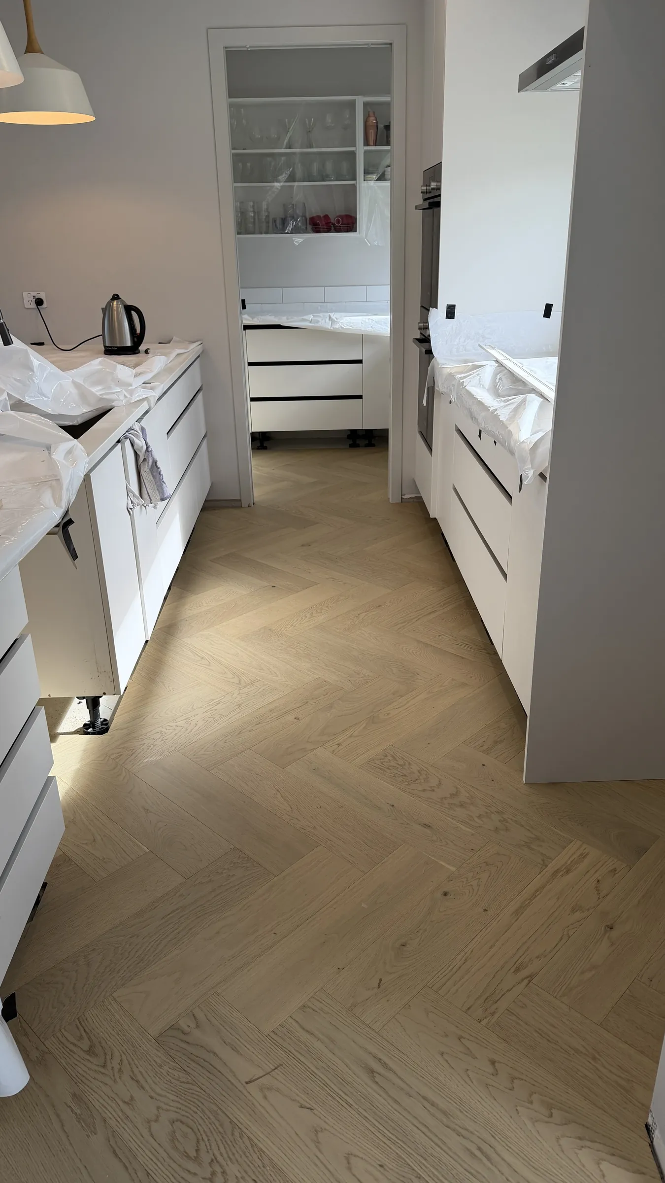 Western herringbone engineered timber through the kitchen at Whitford Park Road, Whitford