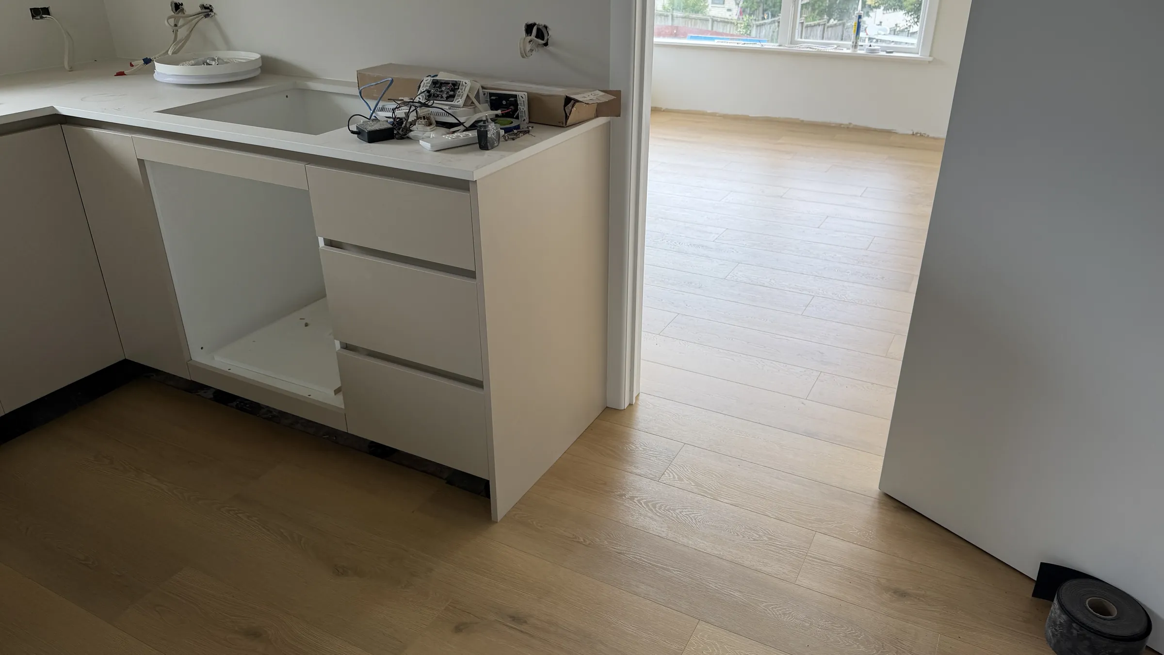 76039-26 laminate under the kitchen mid-install at Te Atatū Road, Te Atatū South