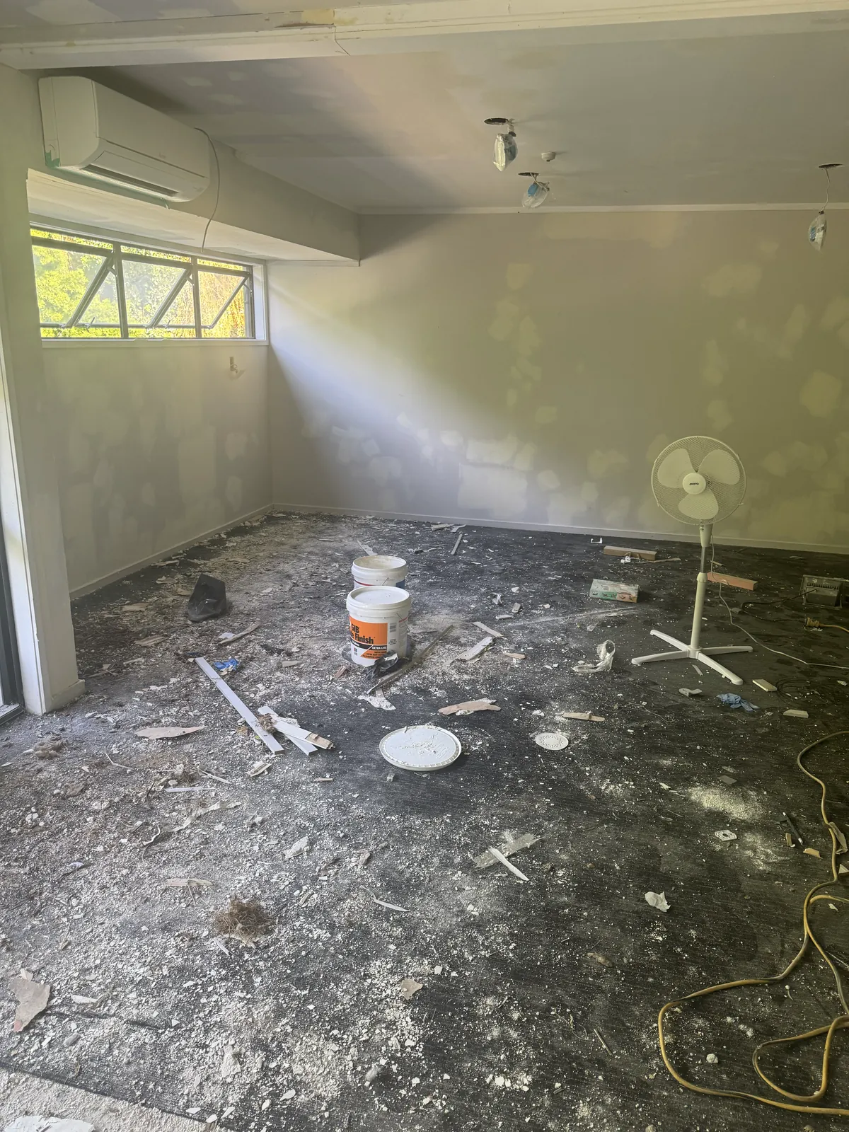 Debris and old floor coverings across the Manukau Hotel breakfast room before the new floor