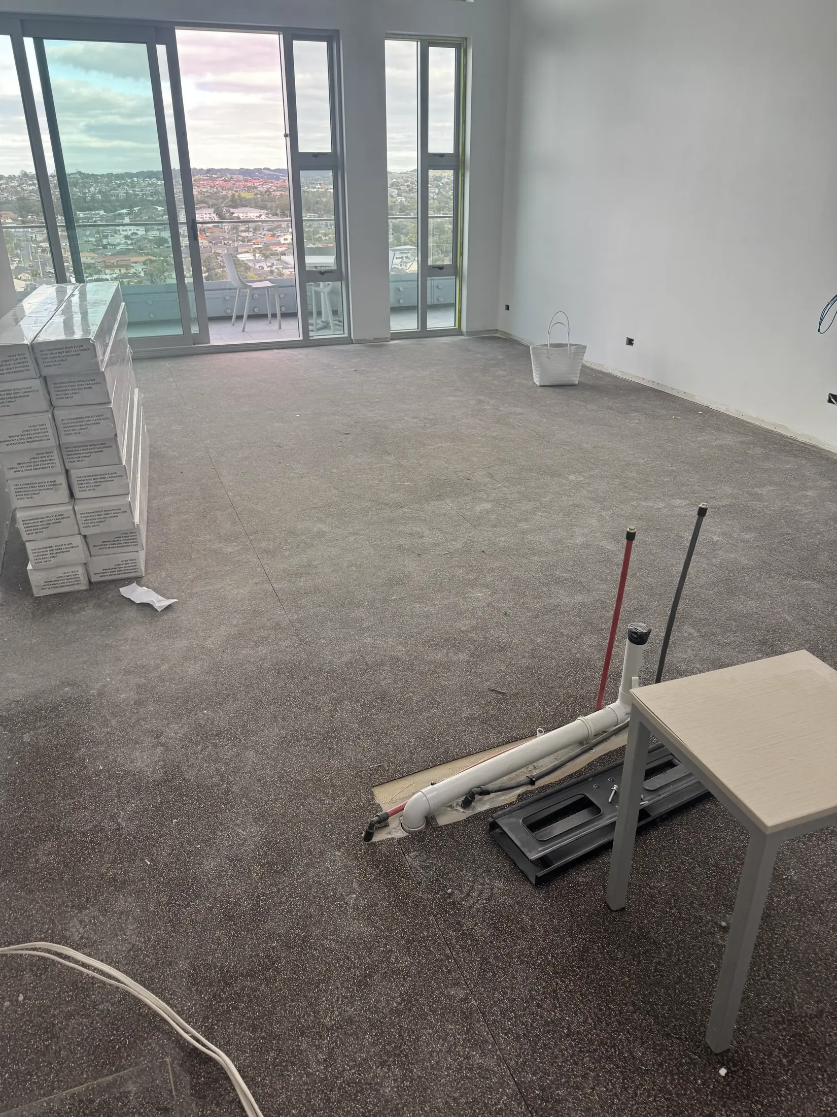 Grey Mapesonic acoustic soundproofing matting exposed across an apartment at The Nautilus, Orewa