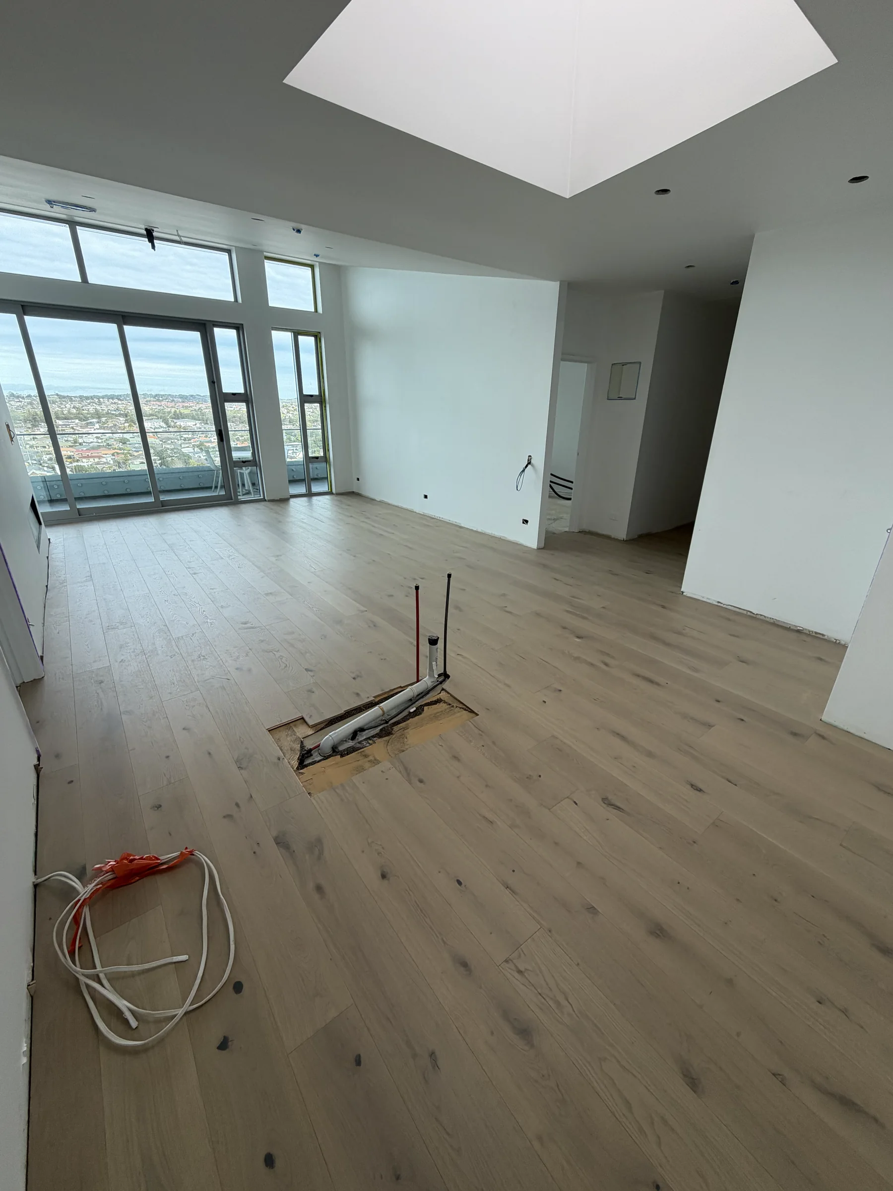 ATS Timber Latte Luxury 190mm flooring laid before the kitchen installation at The Nautilus, Orewa