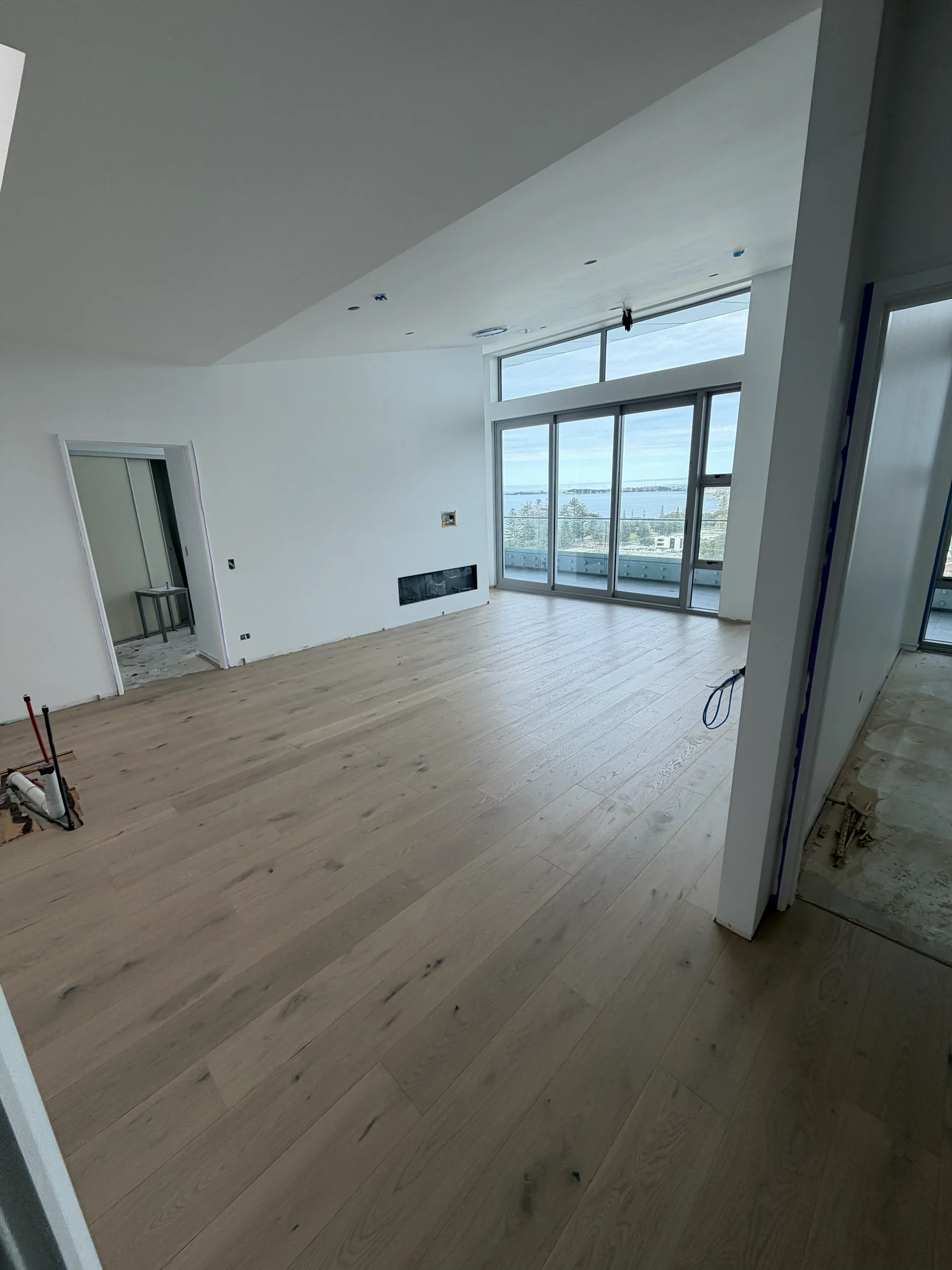 ATS Timber Latte Luxury 190mm flooring laid while other trades continue at The Nautilus, Orewa