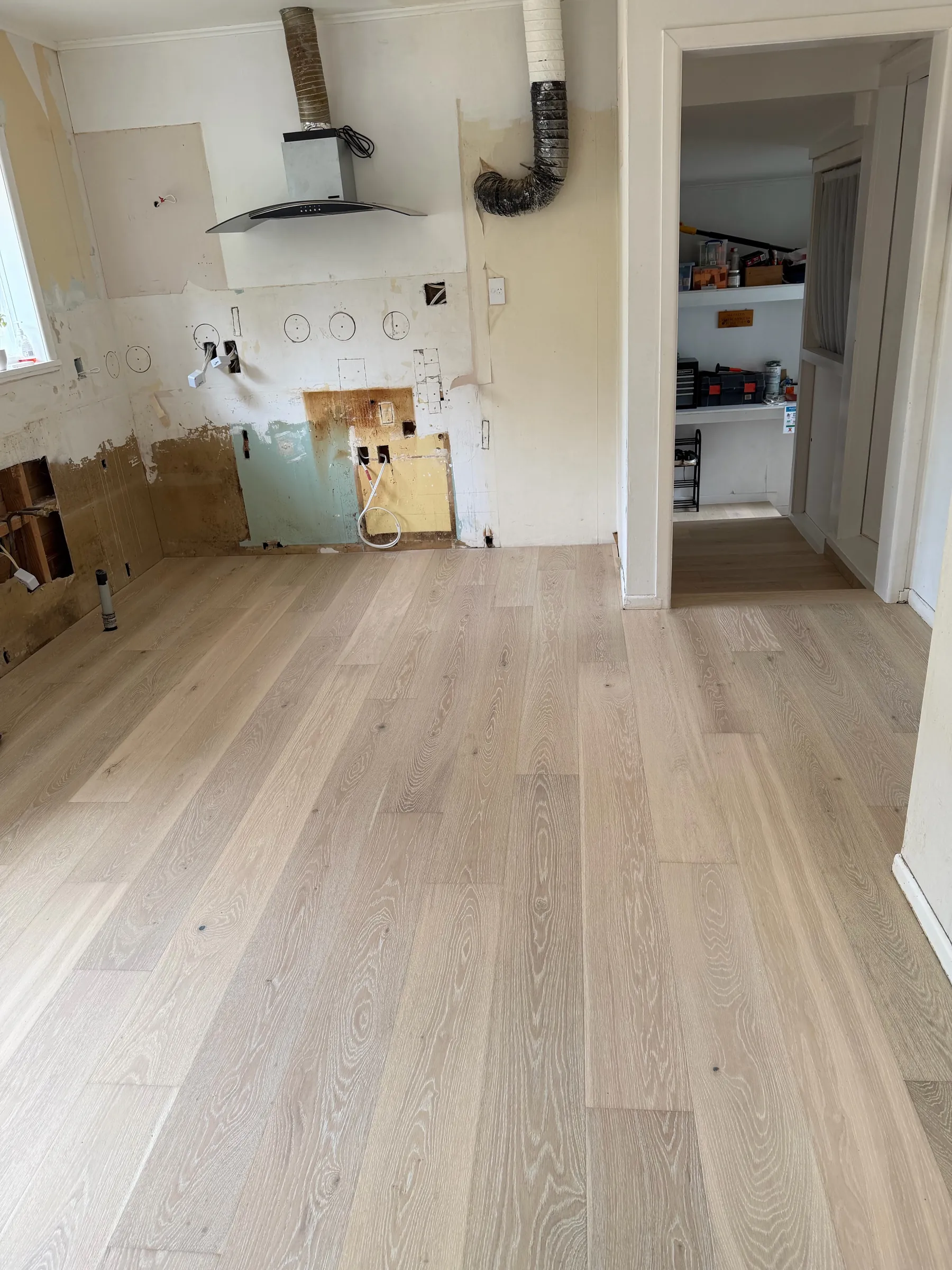 White Wash oak plank laid in the kitchen mid-renovation at Winifred Avenue, Bayview