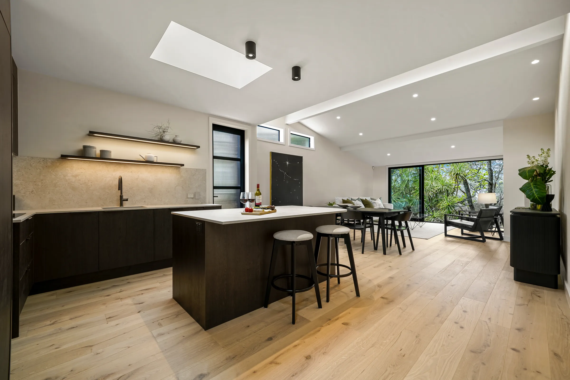 Raw 260 wide engineered timber through the open kitchen, dining and living space at Seaview Road, Remuera