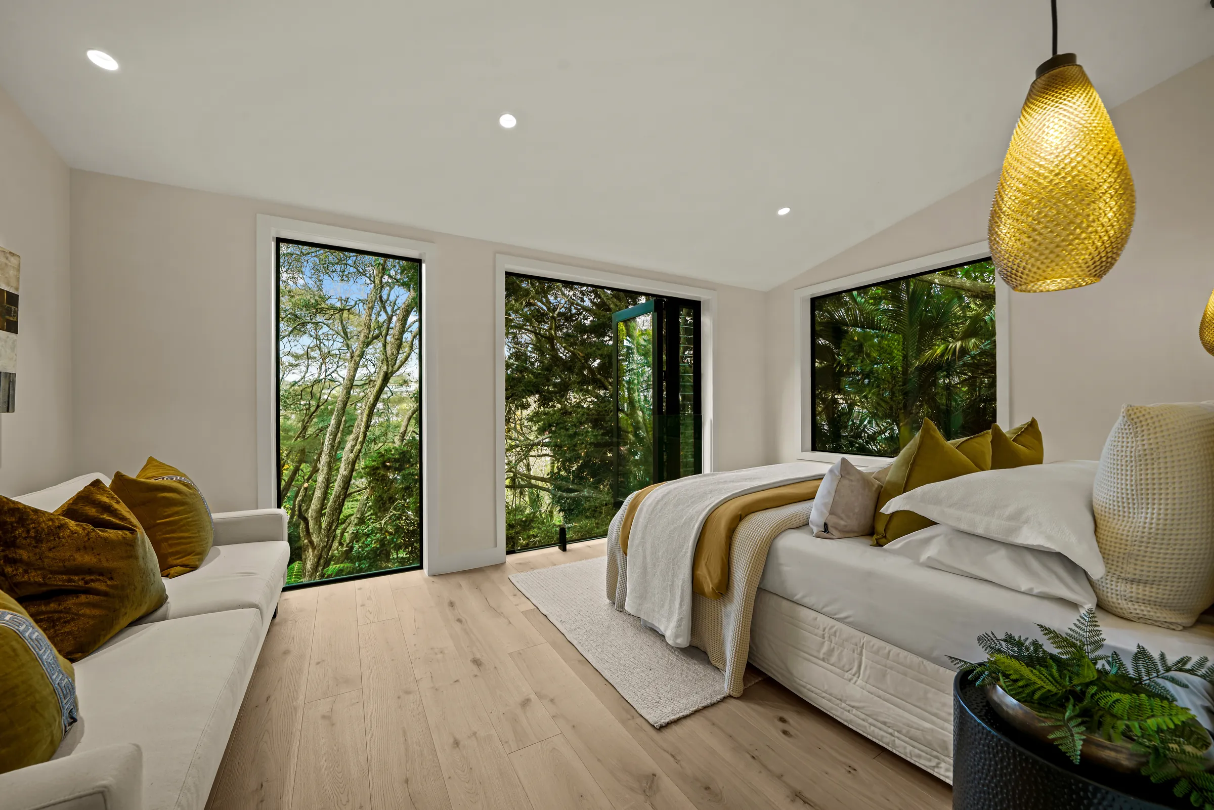 The bedroom among the trees on Raw 260 wide engineered timber at Seaview Road, Remuera
