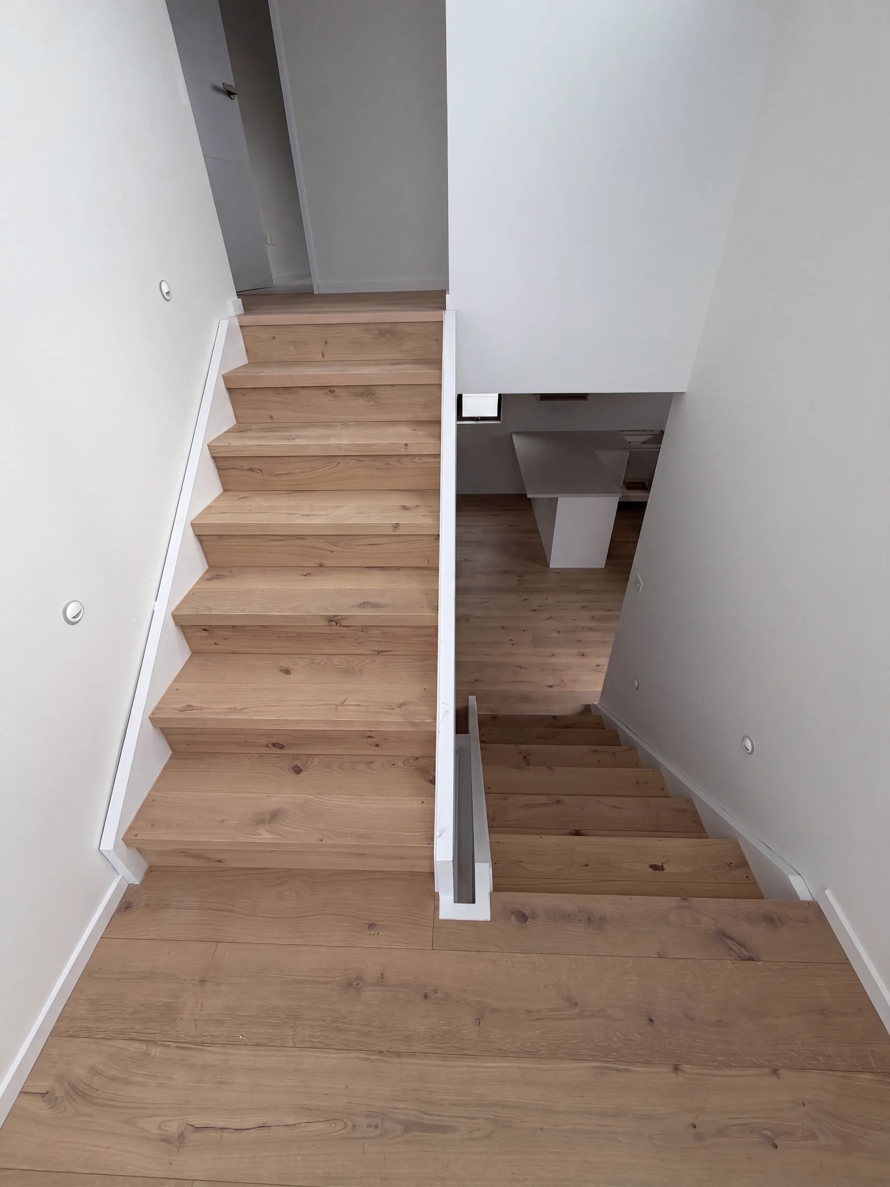 A Light Oak staircase at Manapau Street, Meadowbank, both flights meeting the landing