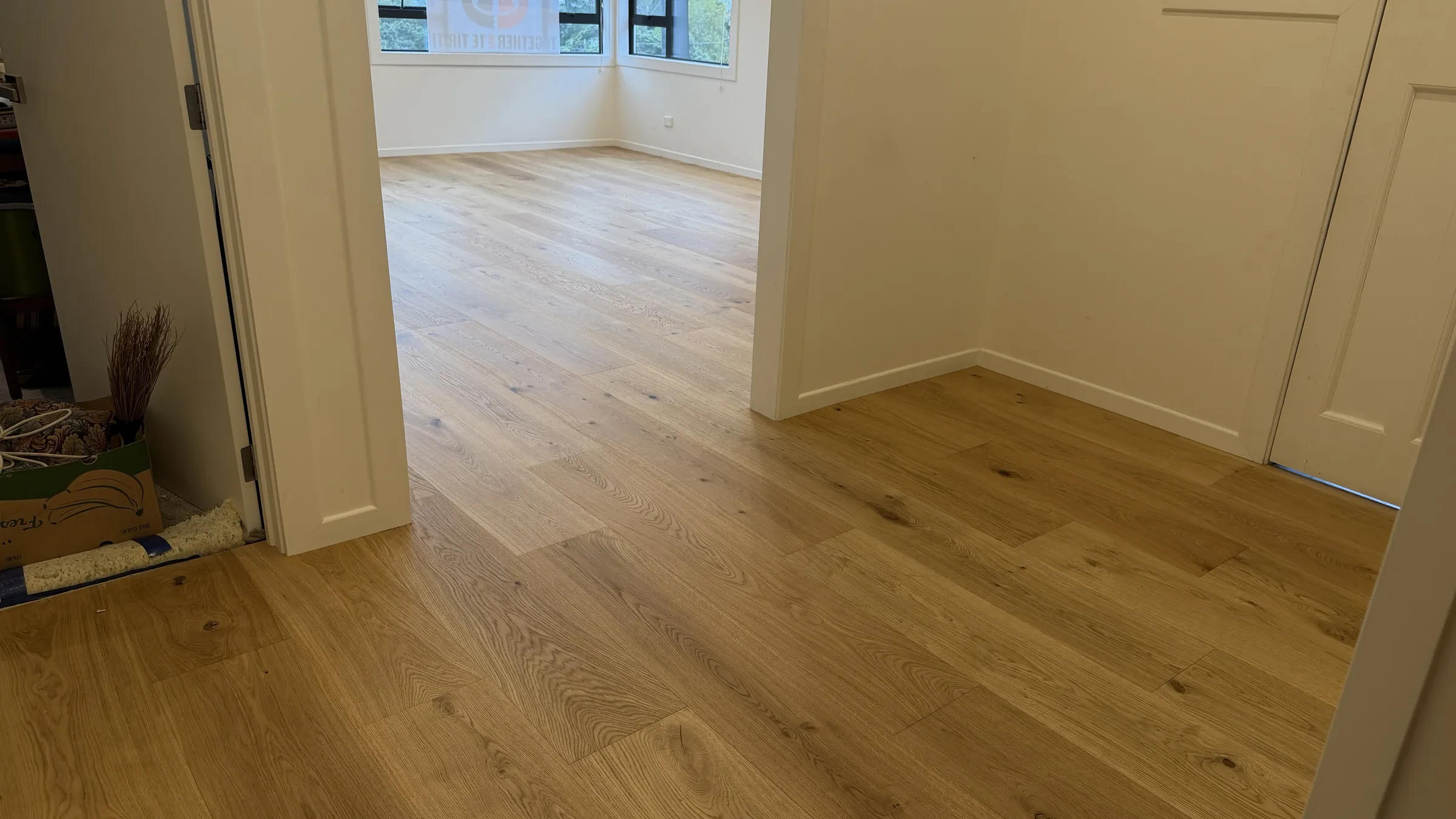 ATS Timber Bean to Beauty 260mm flooring flowing from a hallway into a bright room at Allen Road, Grey Lynn