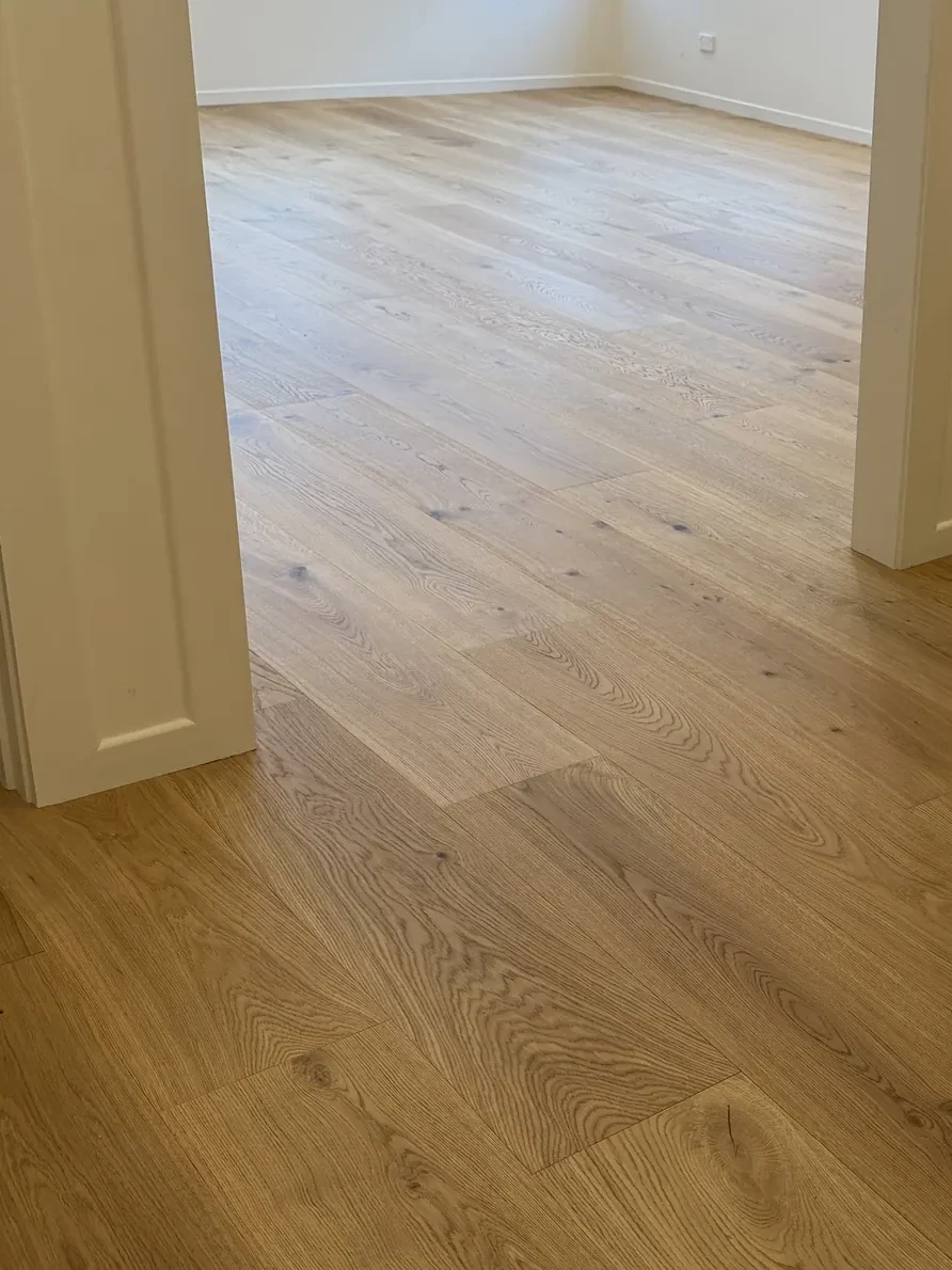 ATS Timber Bean to Beauty flooring catching the sun through a doorway at Allen Road, Grey Lynn