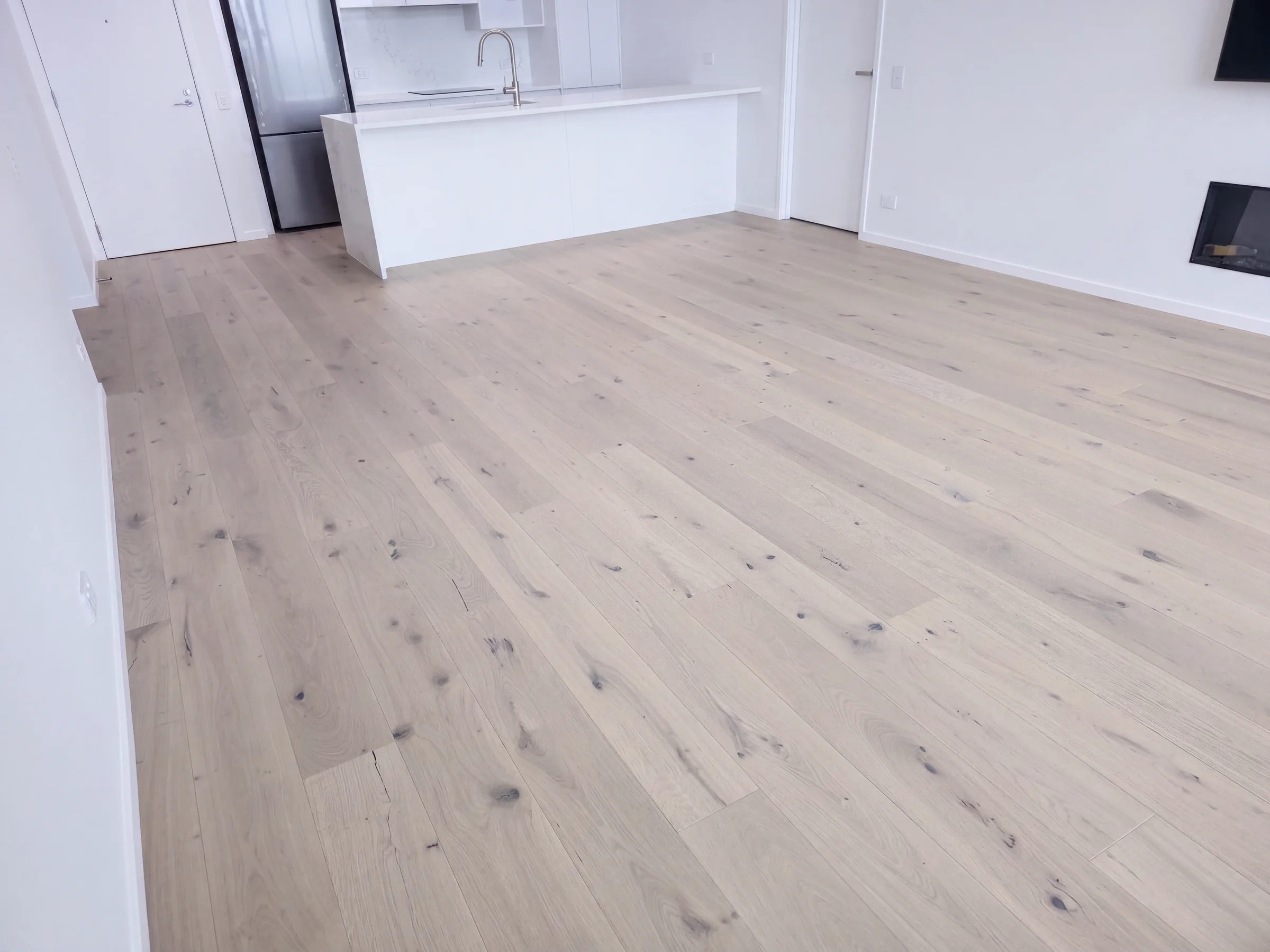 ATS Timber Latte Luxury 190mm flooring sweeping the main room at The Nautilus, Orewa