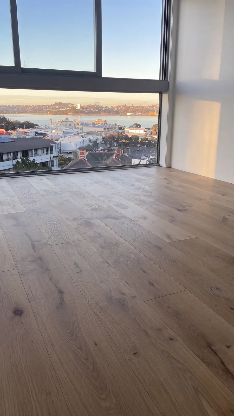 ATS Timber Light Oak meeting the big window and the harbour view at Victoria Road, Devonport