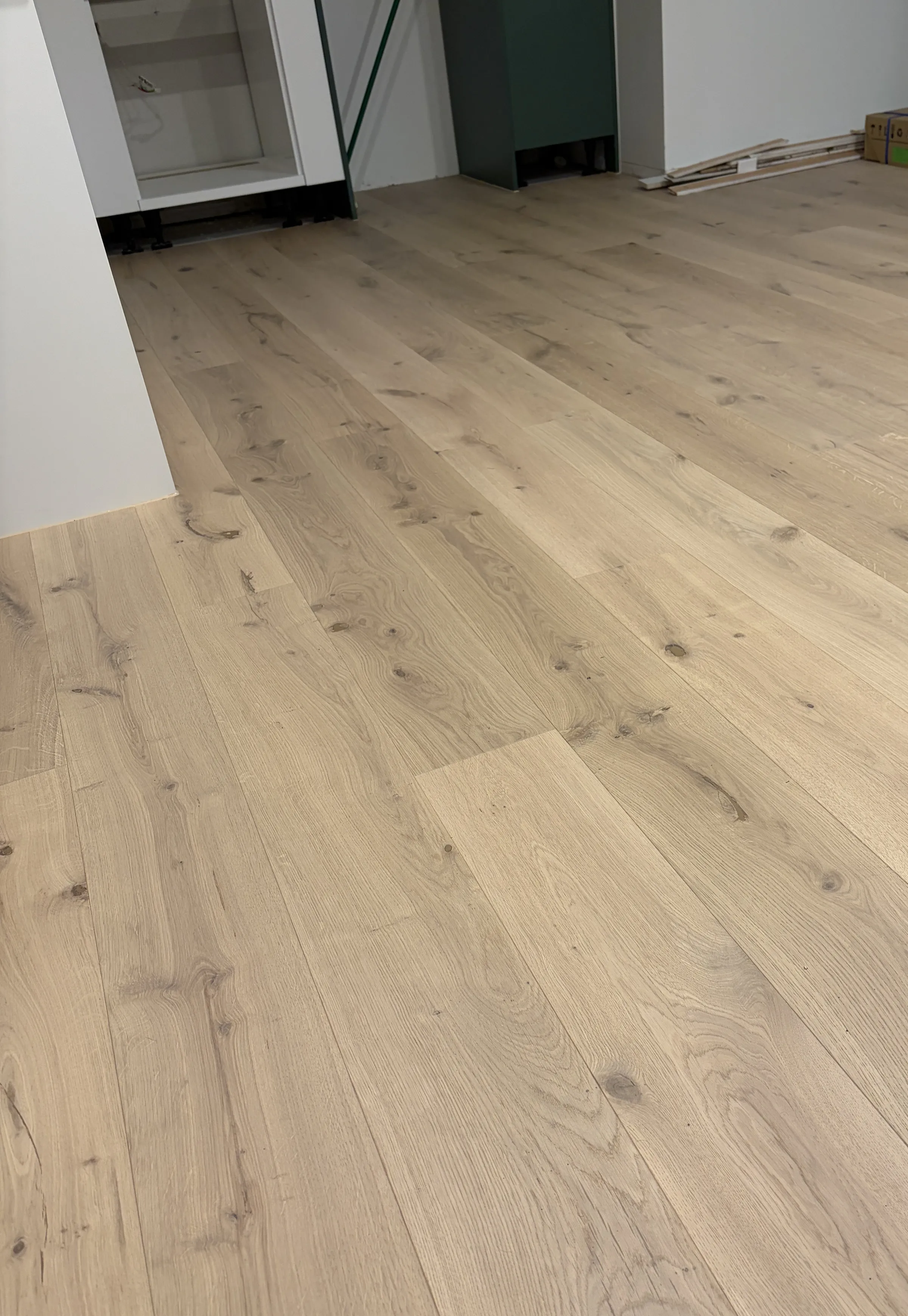 ATS Timber Light Oak flooring freshly laid through an open room before the kitchen is fitted at Douglas Street, Ponsonby