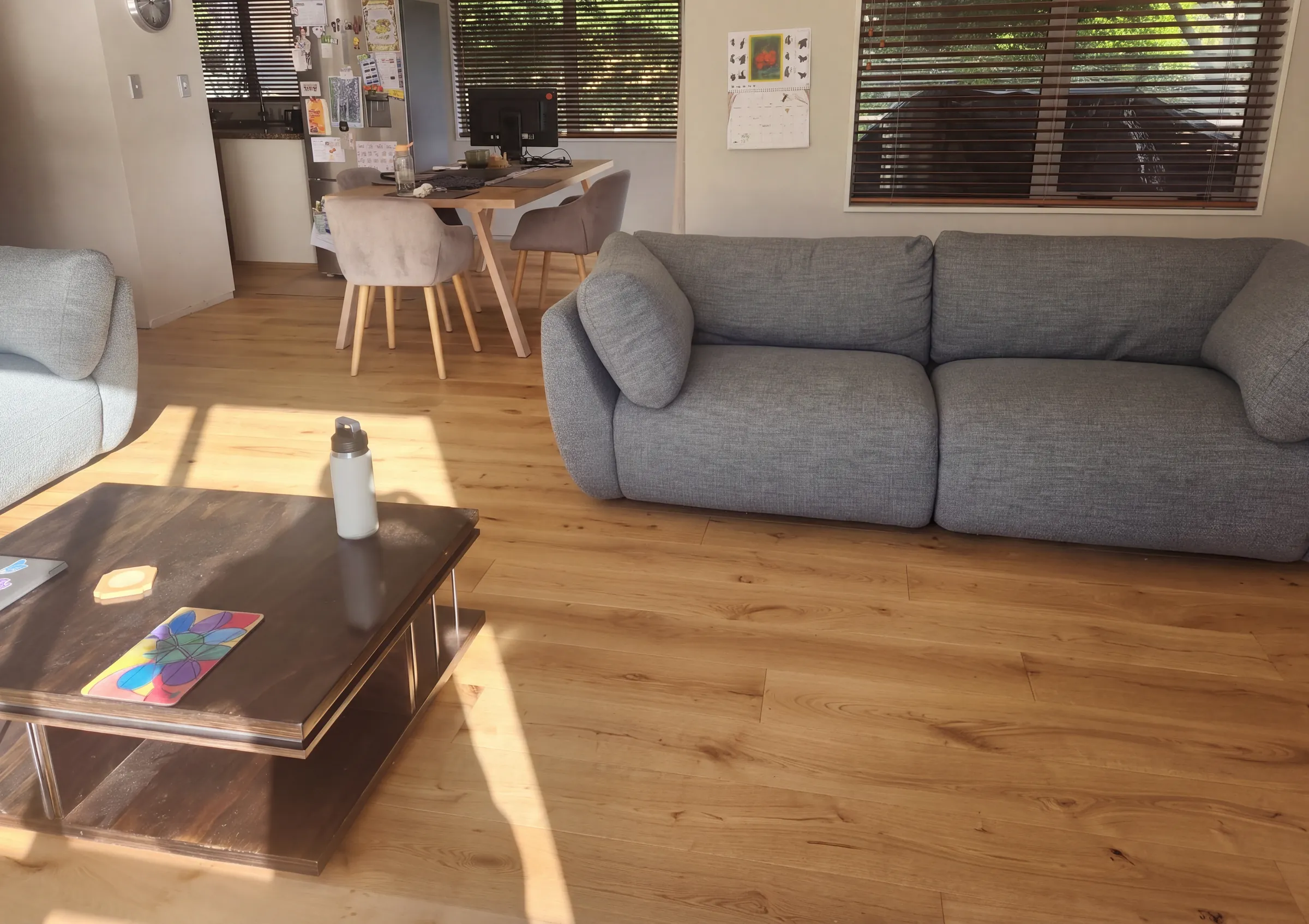 ATS Timber Raw 190mm flooring bringing warm colour to an open living and dining room at Victory Road, Laingholm
