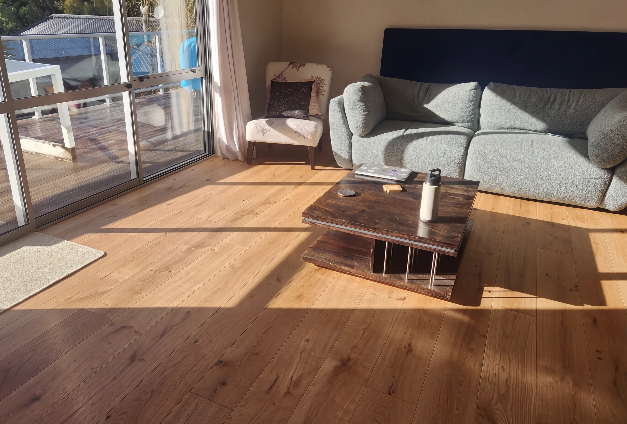 ATS Timber Raw flooring in a sunlit living room at Victory Road, Laingholm