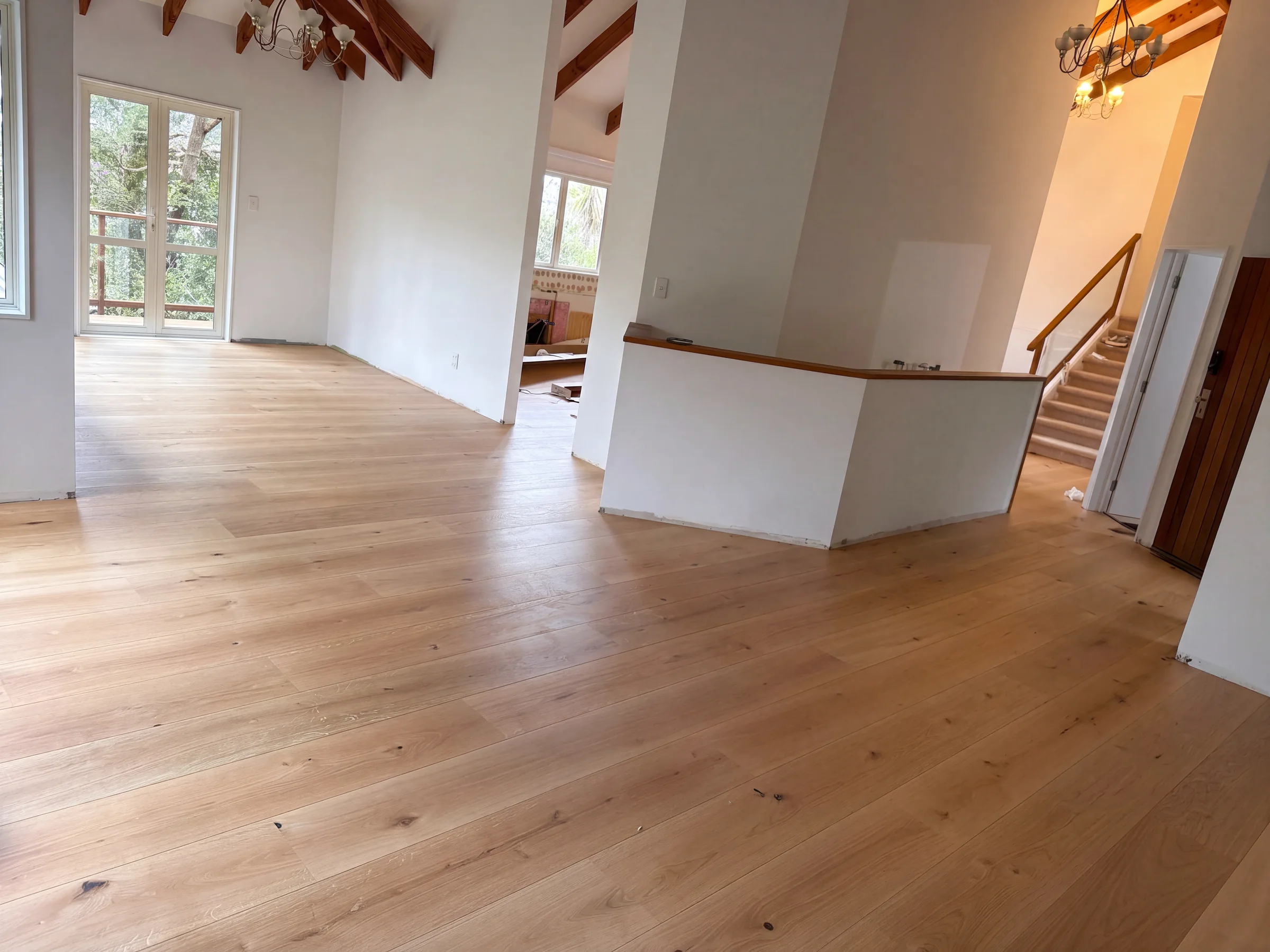 ATS Timber Raw 260mm flooring through an open living room at Beach Road, Campbells Bay