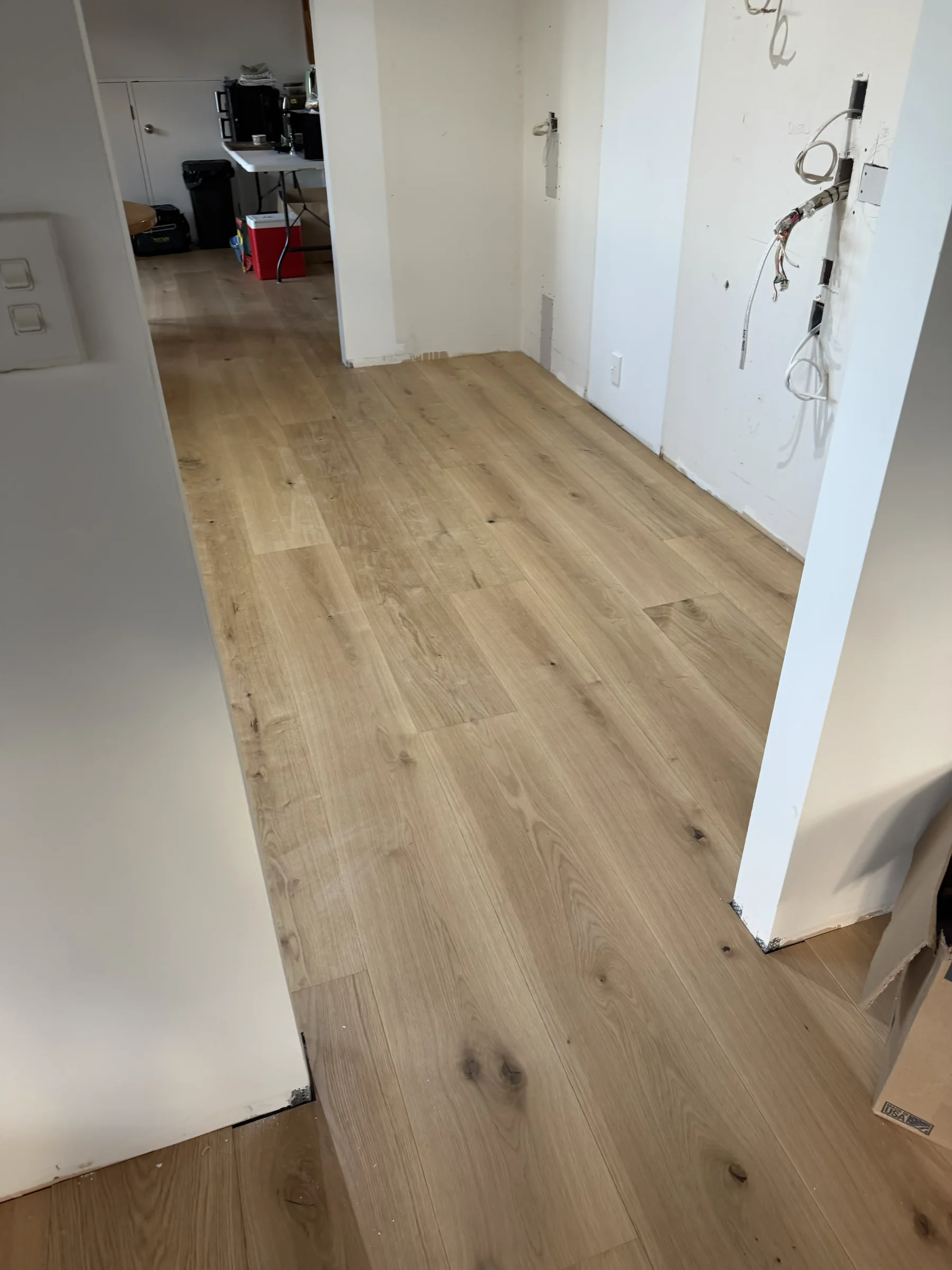 ATS Timber Raw 260mm flooring across the living level toward the stairs at Beach Road, Campbells Bay