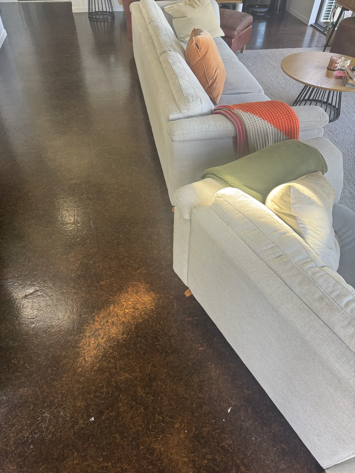 The living room on the old dark floor at Whangaparaoa Road, Red Beach