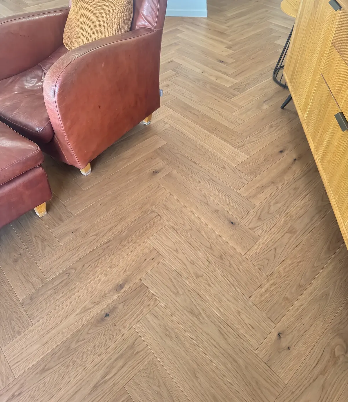 A digital mockup of Natural Clear herringbone drawn onto a photo of the home at Whangaparaoa Road, Red Beach