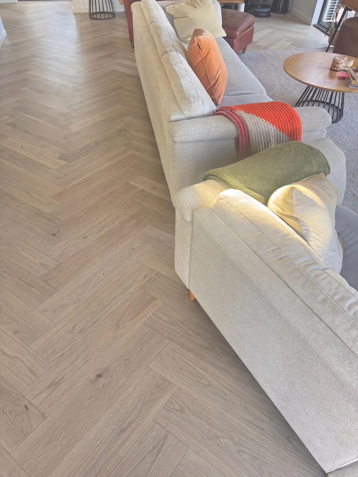 A digital mockup of Natural Clear herringbone in the living room at Whangaparaoa Road, Red Beach