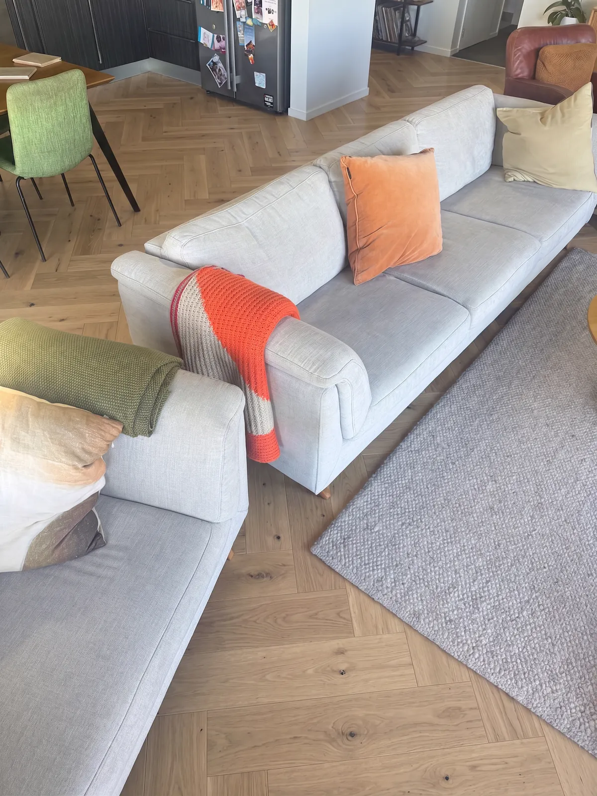 A digital mockup of Natural Clear herringbone across the living space at Whangaparaoa Road, Red Beach