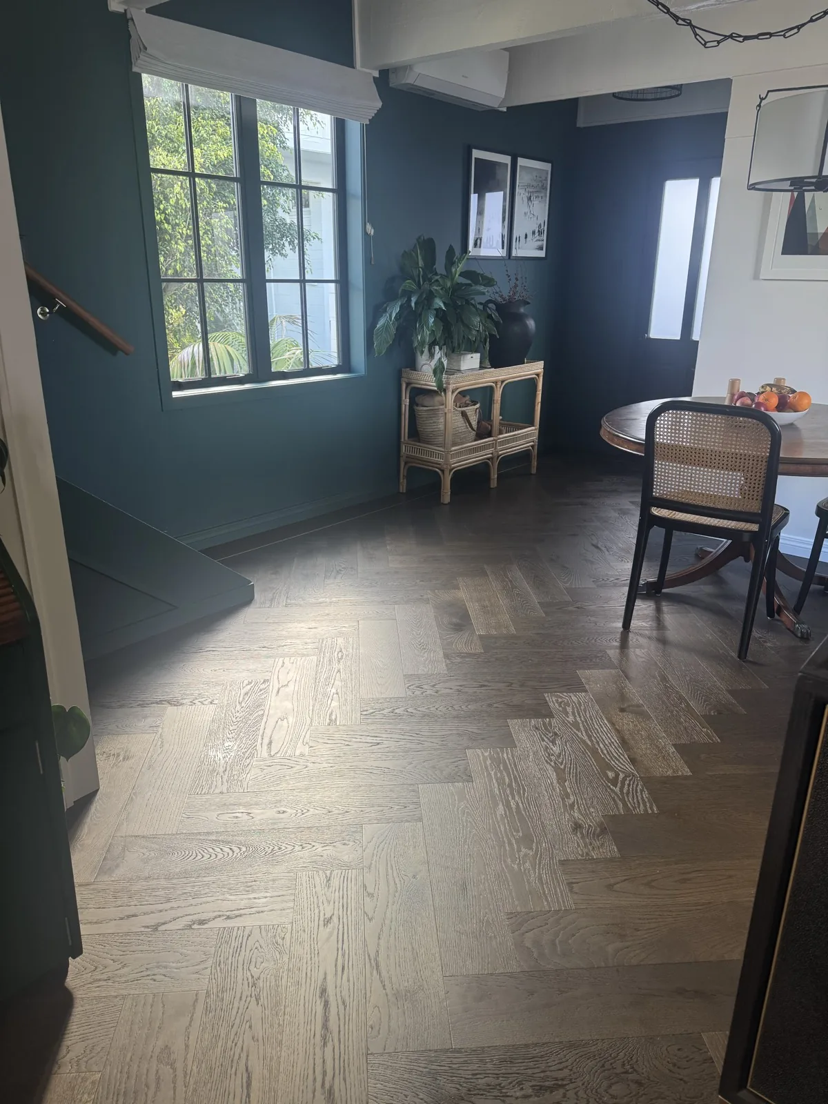 Slate Grey Herringbone flooring running through an open dining room at Kitchener Road, Milford